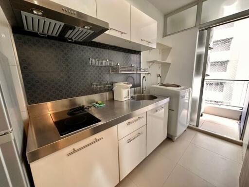 Modern kitchen with stainless steel appliances and ample storage