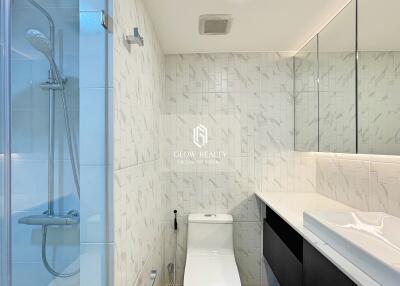 Modern bathroom with shower, toilet, and vanity