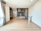 Modern living room with wooden flooring and gray curtains