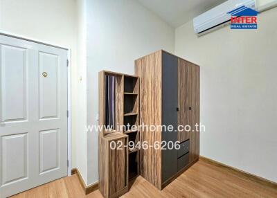 Bedroom with wooden furniture and white door