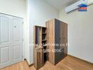 Bedroom with wooden furniture and white door