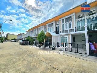 Exterior view of townhouses on a sunny day