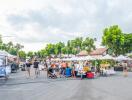 Outdoor market with people and tents