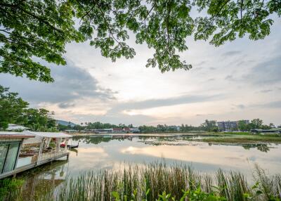 Scenic lake view with trees and sky