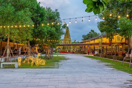 Outdoor communal area with festive decorations and lights