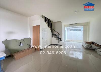 Bright and spacious main living area with staircase