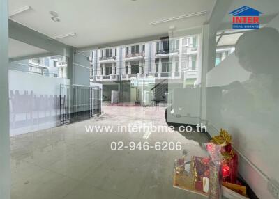 Lobby area with a reflective glass partition and external building view