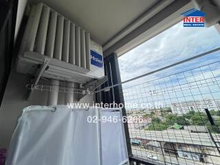 Balcony view with air conditioning unit