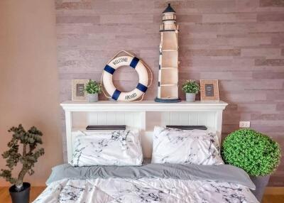 Nautical-themed bedroom with lighthouse decor