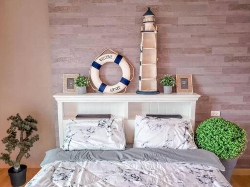 Nautical-themed bedroom with lighthouse decor