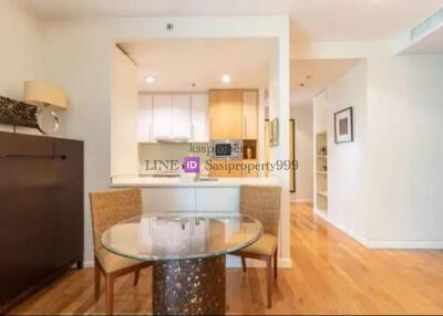 Open kitchen area with dining table and chairs