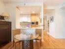 Open kitchen area with dining table and chairs