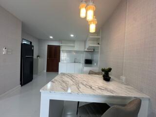 Modern kitchen with dining area and appliances