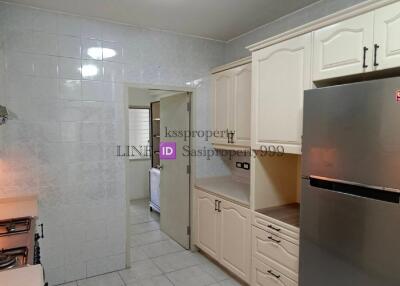 Modern kitchen with stainless steel appliances and white cabinetry