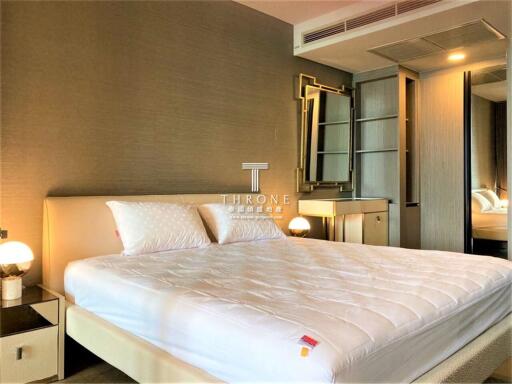 Spacious bedroom with king-sized bed and modern furnishings