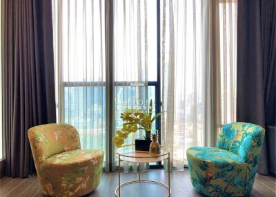 Bright living room with modern chairs and a coffee table