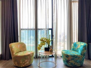 Bright living room with modern chairs and a coffee table