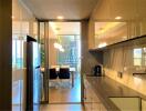 Modern kitchen with appliances and dining area in the background