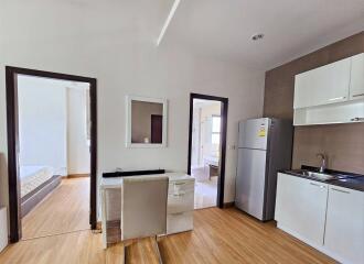 Open living area with kitchen and dining space