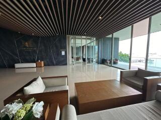 Luxury building lobby with modern furniture and large glass windows