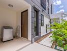 Modern house with side area, washing machine, and garden