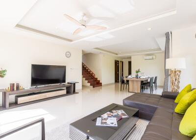 Spacious and well-lit living room with modern furniture