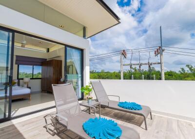 Spacious balcony with lounge chairs and view