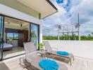 Spacious balcony with lounge chairs and view