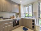 Modern kitchen with wooden cabinets and stainless steel appliances