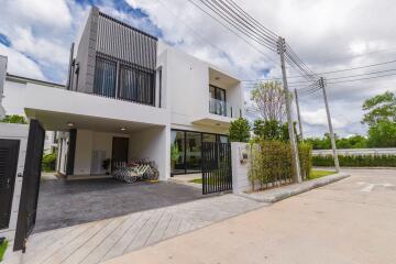 Front view of a modern residential building with driveway