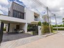 Front view of a modern residential building with driveway