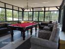 Spacious recreational room with a pool table and seating area