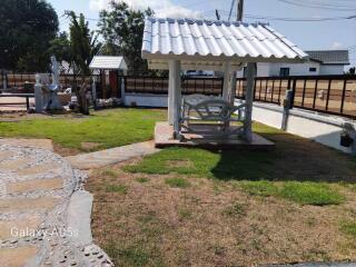 Outdoor seating area with gazebo and garden