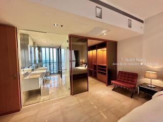 Photo of bedroom with a view into the bathroom