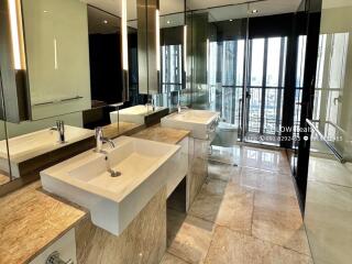 Modern bathroom with double sinks and large mirrors