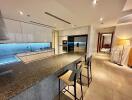 Modern kitchen with granite countertops and bar seating