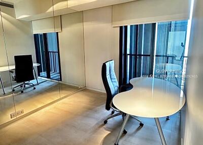 Modern home office with large mirror and ergonomic chair