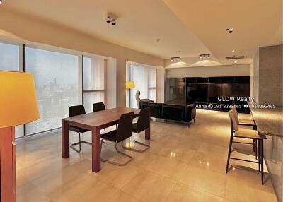 Modern living and dining area with city view