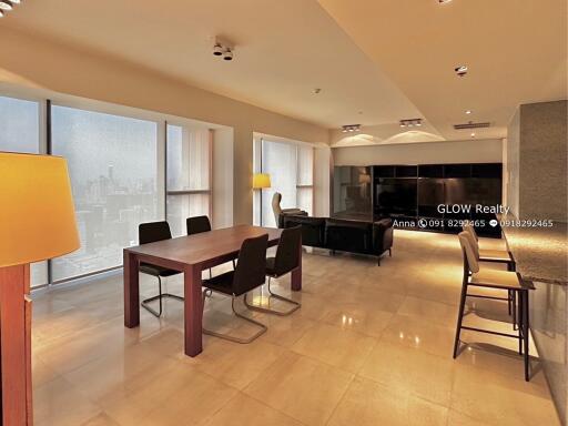 Modern living and dining area with city view