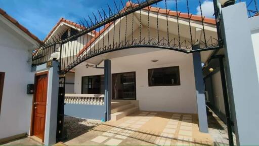 Front view of a house with a gated entrance