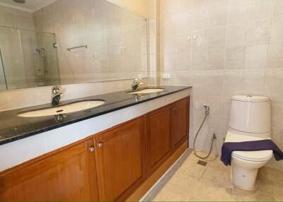 Modern bathroom with double sink and toilet