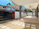 Covered patio with ceiling fans and gate