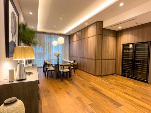 Modern dining area with contemporary furniture and wooden flooring