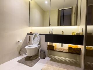 Modern bathroom with large mirror and elegant fixtures