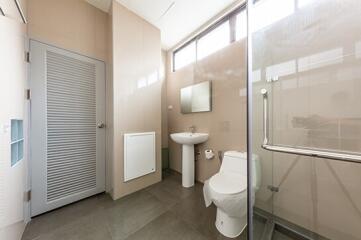 Modern minimalist bathroom with glass-enclosed shower