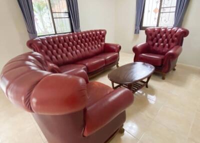 Living Room with Red Leather Furniture