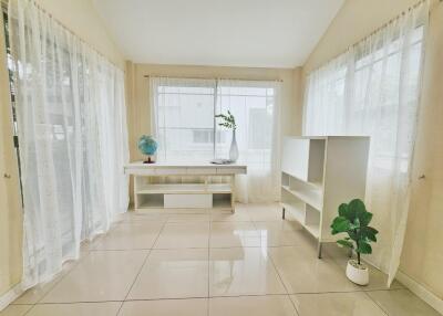 Bright living room with large windows and minimalistic decor