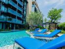 Outdoor pool area with lounge chairs