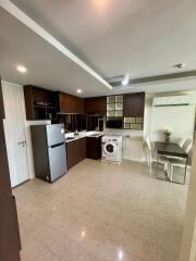 Modern kitchen with dining area and appliances