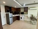 Modern kitchen with dining area and appliances